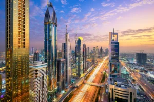 Dubai skyline with the sun shining.